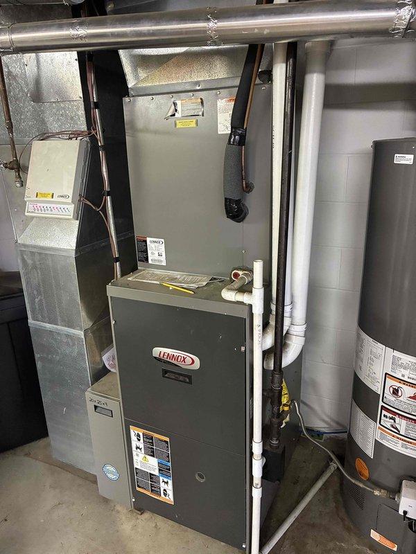 Completed routine air conditioning tune-up on 17-year-old Lennox system in residential basement installation. Performed comprehensive maintenance including thorough washing of outdoor condenser coil to remove accumulated debris and improve heat transfer efficiency. All system components inspected and found operating within normal parameters with no issues identified.
