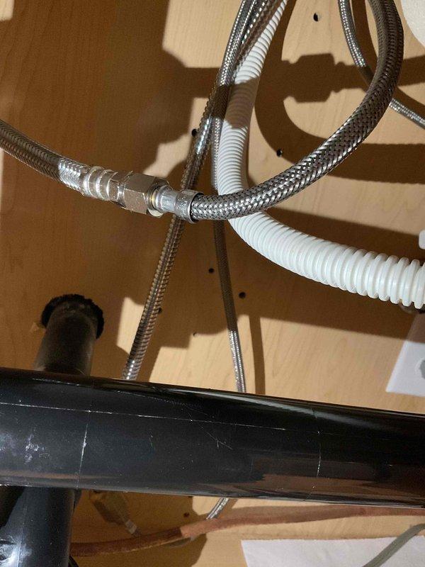 Responded to a water leak under the kitchen sink and successfully replaced a faulty angle stop valve and supply line. The old angle stop was leaking and causing water damage, so new components were installed to restore proper function and prevent further leakage.