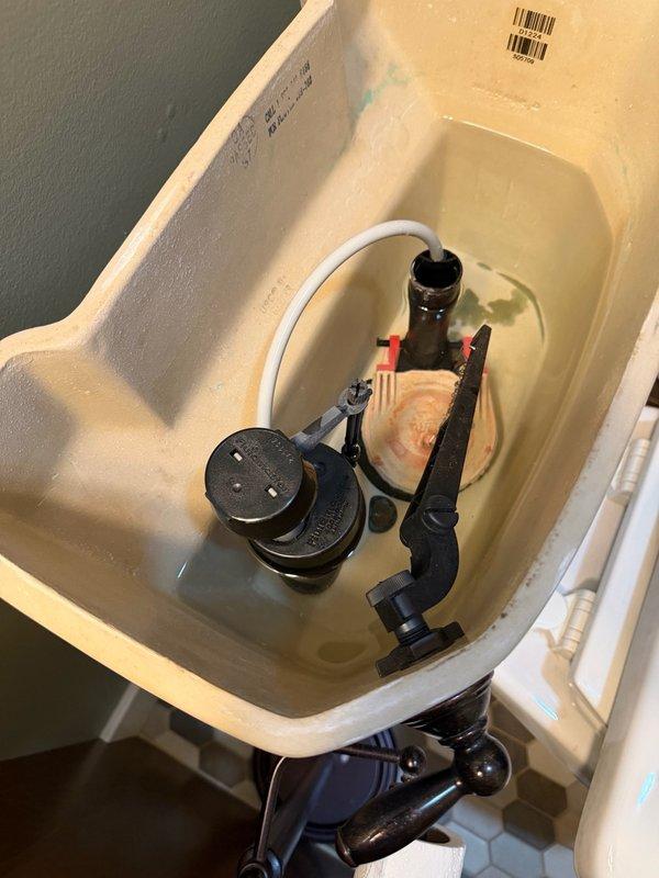 Responded to service call for upstairs toilet not filling with water. Upon arrival, found fill valve assembly stuck against side of toilet tank, preventing proper operation. Repositioned fill valve to correct position within tank. Verified toilet was filling properly and flushing normally with all components functioning as designed.