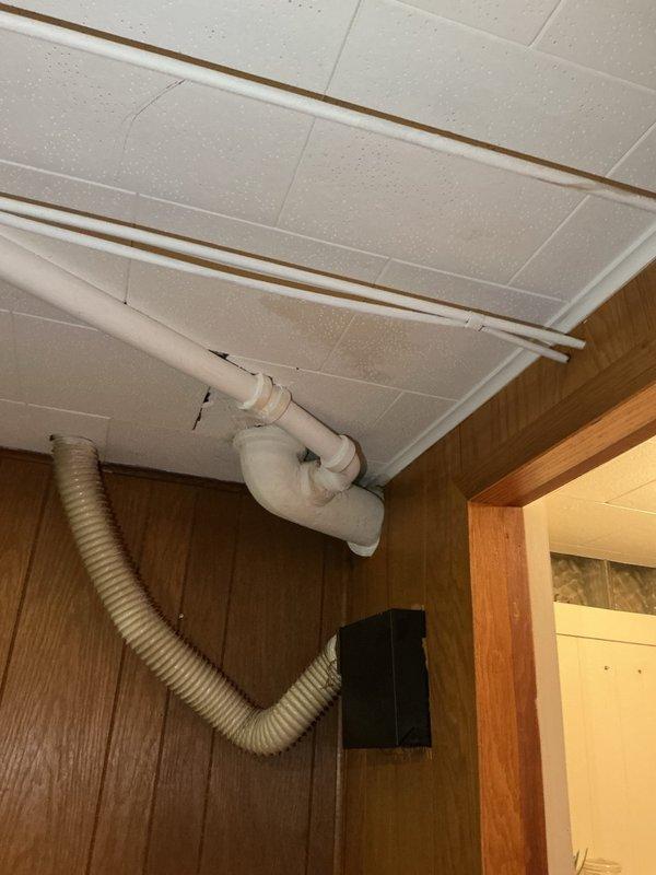 Responded to a slow-draining bathroom tub issue caused by a deteriorated overflow assembly. Removed the old overflow and drain components and installed new replacement parts to restore proper drainage function. System tested successfully upon completion with water now draining at normal rate.