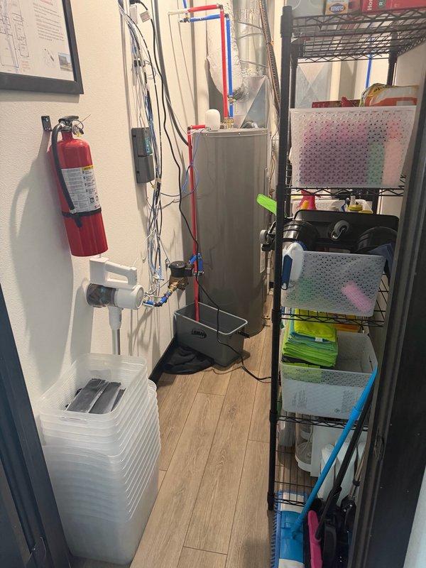 Responded to a water pressure issue causing flooding around the water heater and utility systems. Upon inspection, identified that the property lacks a pressure reducing valve (PRV), resulting in fluctuating water pressure between 60-86 psi throughout the home. The excessive pressure was causing the temperature and pressure relief valve on the tanked water heater to discharge intermittently, leading to water spillage in the utility room. Documented the existing plumbing configuration, including the water heater installation and associated piping systems. Provided estimates for installing a PRV to regulate incoming water pressure and prevent future T&P valve discharge incidents.