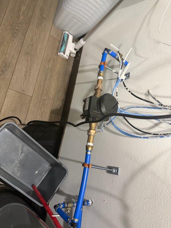 Responded to a water pressure issue causing flooding around the water heater and utility systems. Upon inspection, identified that the property lacks a pressure reducing valve (PRV), resulting in fluctuating water pressure between 60-86 psi throughout the home. The excessive pressure was causing the temperature and pressure relief valve on the tanked water heater to discharge intermittently, leading to water spillage in the utility room. Documented the existing plumbing configuration, including the water heater installation and associated piping systems. Provided estimates for installing a PRV to regulate incoming water pressure and prevent future T&P valve discharge incidents.