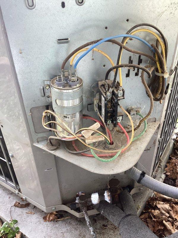 Completed Family Rewards annual cooling maintenance visit on residential air conditioning system. Performed comprehensive tune-up including inspection of outdoor unit electrical components, capacitor, contactor, and wiring connections; all components found operational with normal age-related weathering noted. Indoor furnace and HVAC system inspected with gas connections, ductwork, and filtration systems verified in proper working order.
