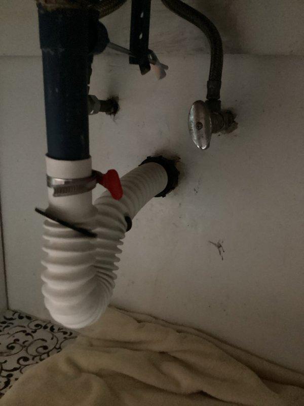 Responded to water leak underneath bathroom sink. Upon inspection, discovered the tubular drain assembly was improperly installed, causing the leak. Removed the incorrectly plumbed P-trap and drain components. Replaced and repiped the complete tubular assembly with proper configuration, ensuring all connections were secure and watertight. Tested the system to verify no leaks were present and proper drainage was restored.