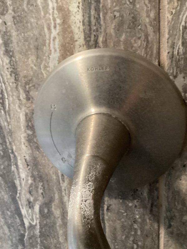 Completed comprehensive plumbing inspection of residential property. Investigated reported issue with downstairs faucet experiencing continuous running and dripping after shutoff. Inspected bathroom fixtures including tub/shower valve assemblies with brushed nickel finishes and Kohler shower valve trim. Documented condition of all plumbing fixtures and captured photographic evidence of installations for service records.