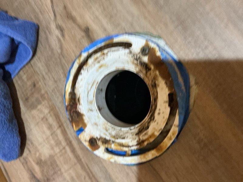 Responded to toilet repair at location 12-5 where inspection revealed a cracked toilet flange. Removed the existing corroded and deteriorated closet collar, which exhibited significant rust damage and structural compromise. Installed a new closet collar to restore proper toilet mounting and ensure a secure, leak-free seal for the fixture.