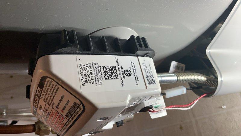 Responded to a no-hot-water call and diagnosed a failed gas valve on a tanked water heater where the status box was damaged, preventing pilot light operation and status light activation. A component of the gas valve assembly had broken off, rendering it inoperable. Replaced the gas valve with a new unit outside of warranty per customer preference to expedite restoration of service, completed installation, tested system operation, and restored hot water functionality.