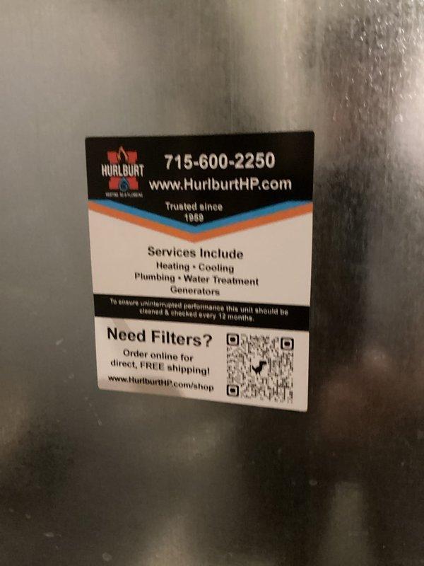 Completed annual cooling maintenance and tune-up on residential air conditioning system under Family Rewards membership agreement. Performed comprehensive inspection of outdoor condensing unit, verified refrigerant lines and electrical connections, and confirmed system operational status with no issues identified. Applied Hurlburt service sticker to unit documenting maintenance completion and 12-month service interval reminder.