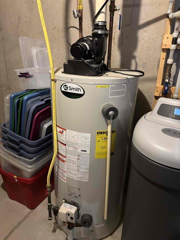 Completed annual cooling maintenance on one Daikin AC system with 410A refrigerant under ambient conditions of 83 degrees. Inspected indoor air handler including filter, drain pan, blower motor, electrical wiring, and components with all items found satisfactory. Verified temperature split across evaporator coil within acceptable range. Inspected outdoor condenser unit including coil cleanliness and electrical components. Identified dual-run capacitor (45+5 MFD) reading outside manufacturer specifications and recommended replacement with estimate provided. Verified amp draw on condenser fan motor, compressor, and contactor within normal operating parameters. Confirmed refrigerant charge at proper levels with no leaks detected. Discovered condensation accumulation inside furnace chamber, likely attributed to intake air configuration combined with elevated outdoor temperatures and humidity. Recommended installation of inline drain on combustion air intake to prevent future moisture infil