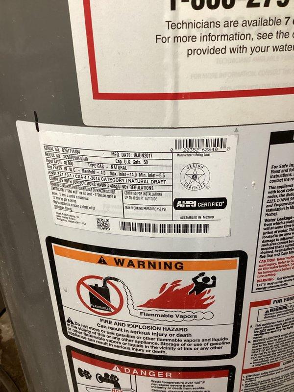 Responded to no hot water complaint affecting entire residence. Upon inspection, discovered 9-year-old water heater with partially melted gas valve, rendering unit unsafe for continued operation. Replaced failed water heater with new Rheem Performance Plus tanked gas water heater. Installed unit in basement utility area with proper copper piping connections, ensuring compliance with manufacturer specifications and safety standards. Verified all connections, tested system operation, and confirmed hot water restoration throughout the home.