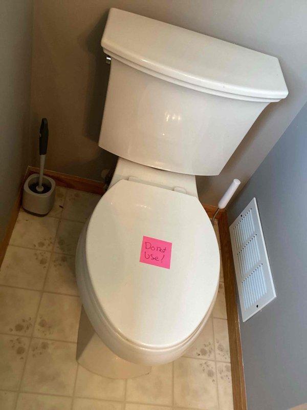 Responded to water leak originating from second-floor bathroom fixtures causing damage to basement ceiling below. Upon inspection, identified deteriorated tub shoe as primary source of leak, with waste and overflow assembly requiring replacement. Toilet tagged out of service as precautionary measure during assessment. Replaced defective waste and overflow components to eliminate active leak and prevent further water intrusion to lower level. Documented conditions with photographic evidence prior to repair completion.