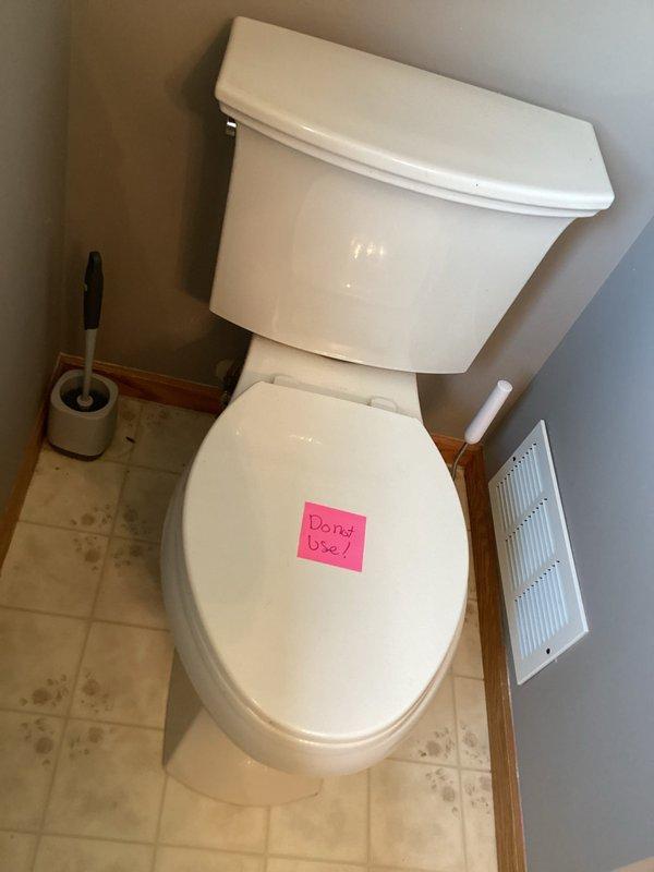 Responded to water leak originating from second-floor bathroom fixtures causing damage to basement ceiling below. Upon inspection, identified deteriorated tub shoe as primary source of leak, with waste and overflow assembly requiring replacement. Toilet tagged out of service as precautionary measure during assessment. Replaced defective waste and overflow components to eliminate active leak and prevent further water intrusion to lower level. Documented conditions with photographic evidence prior to repair completion.