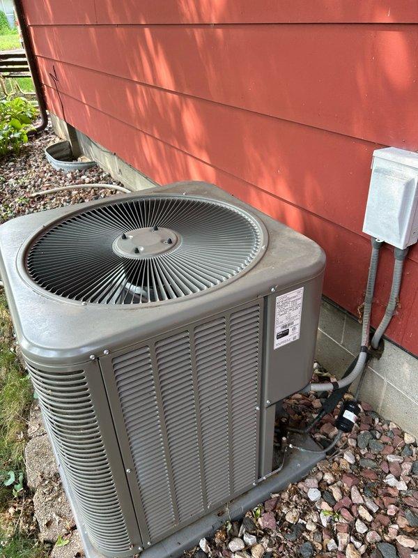 Completed scheduled preventative maintenance on a 4-year-old Lennox air conditioning system. Performed comprehensive AC tune-up inspection including verification of thermostat operation and calibration, air filter condition and replacement, blower assembly function, outdoor condensing unit coil cleanliness, all electrical connections and components, contactor condition, capacitor performance, condensate drain line operation, refrigerant charge levels, and system temperature split across the evaporator coil. All operational readings measured within manufacturer specifications with no mechanical defects, refrigerant leaks, or safety concerns identified. System confirmed operating at optimal efficiency with proper airflow and cooling capacity.
