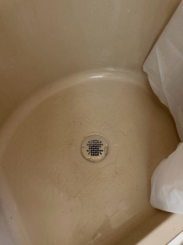 Responded to multiple plumbing issues including slow-draining bathtub, leaking shower, and kitchen faucet replacement needs. Cleared tub drain obstruction caused by accumulated hair buildup and accessed crawl space to install new shower drain assembly to resolve leak. Provided estimate for installation of homeowner-supplied kitchen faucet fixture.