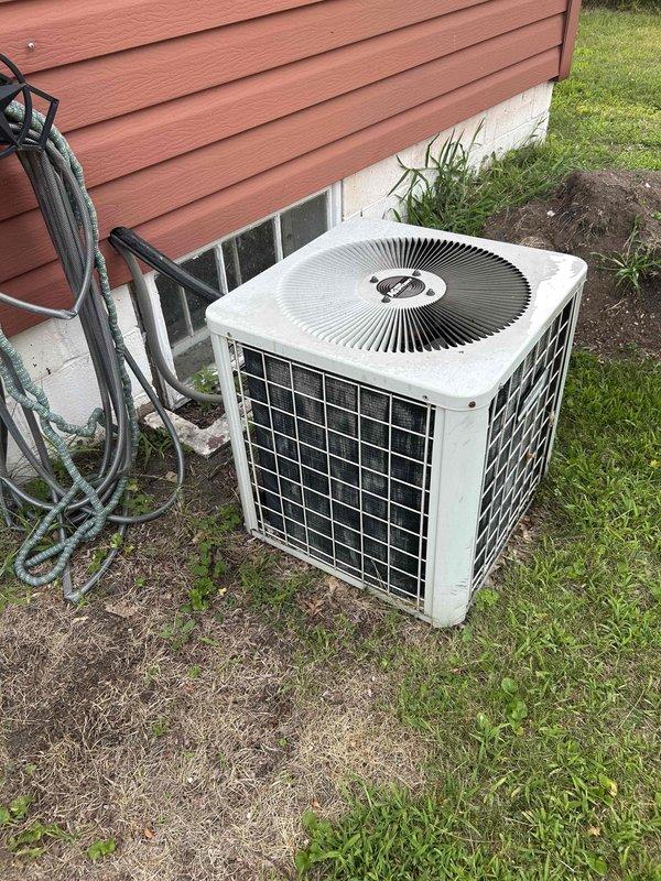 Responded to no cooling complaint on residential air conditioning system. Upon inspection of outdoor condensing unit, found compressor with severely deteriorated terminals and significant internal corrosion. Compressor terminals were non-existent due to age and environmental damage. Given the extent of deterioration, age of existing equipment (10+ years), and cost-effectiveness of repair versus replacement, recommended complete system replacement rather than compressor replacement alone. Customer approved full unit replacement. Removed old condensing unit and installed new outdoor air conditioning unit. Completed all refrigerant line connections, electrical wiring, and system startup. Verified proper operation of new equipment with system running and cooling effectively. System now operational and providing adequate cooling to residence.