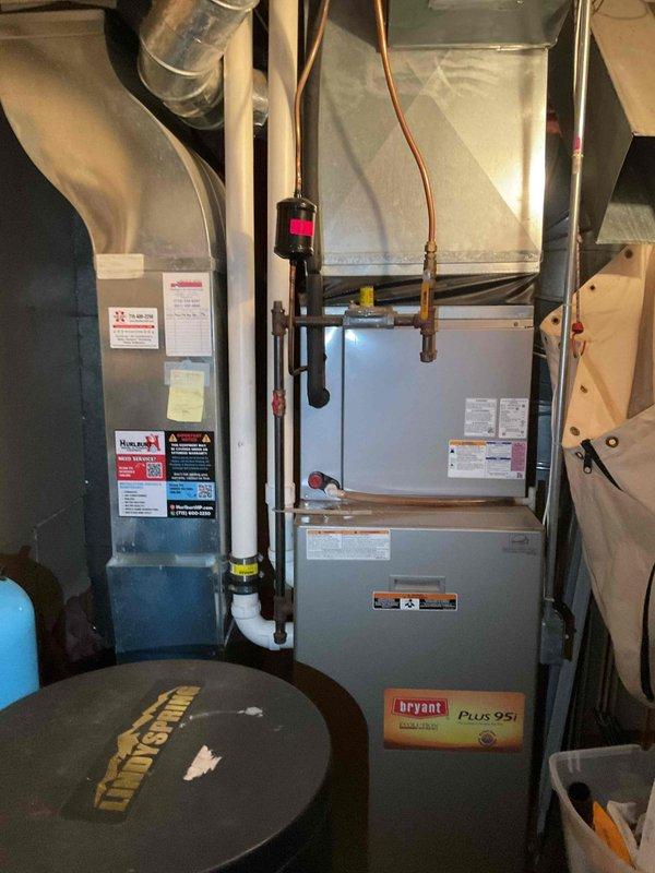Completed annual cooling maintenance on residential HVAC system with Bryant Plus 95i furnace and air handler. System found to be low on refrigerant during routine tune-up inspection. Submitted estimate for refrigerant recharge, leak detection service, and potential system replacement options for customer consideration.