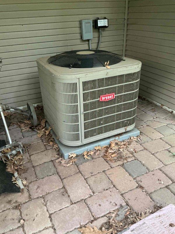 Performed comprehensive preventative maintenance on an 8-year-old Bryant air conditioning system as part of routine membership agreement service. Conducted full system inspection including electrical component testing, verified contactor and capacitor operation within normal parameters, confirmed proper refrigerant charge levels, measured amp draws on compressor and fan motor, and inspected evaporator coil for cleanliness. Performed condenser coil cleaning by rinsing exterior unit to remove debris and ensure optimal heat transfer efficiency. Verified system performance with temperature differential measurement across evaporator coil, confirming 18-degree split within manufacturer specifications. All components found operating properly with no deficiencies identified or corrective actions required at this time.