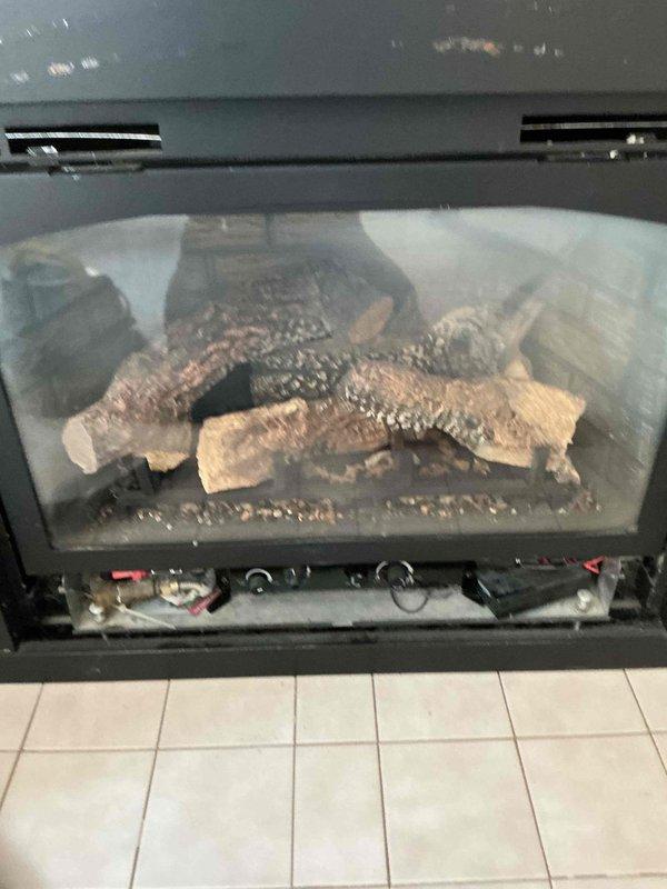 Completed annual maintenance on gas fireplace unit model X6364. Performed comprehensive tune-up including thorough cleaning and vacuuming of firebox, burner assembly, and log set. Verified operational functionality of all components and confirmed unit is operating safely and efficiently.