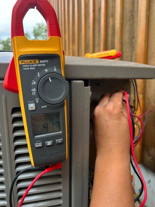 Responded to a no cooling call on a 7-year-old AC system. Upon arrival, inspected the outdoor unit and found the condenser coils dirty; cleaned thoroughly. Verified contactor and capacitor were operating normally with proper 240V power supply to the outdoor unit. Traced power issue to the indoor furnace where no 120V was present. Located tripped breaker at electrical panel, reset breaker, and restored power to the system. Tested system operation and confirmed unit running properly. Performed refrigerant pressure readings which were within manufacturer specifications. Recommended follow-up electrical inspection to determine root cause of breaker trip and prevent future occurrences.