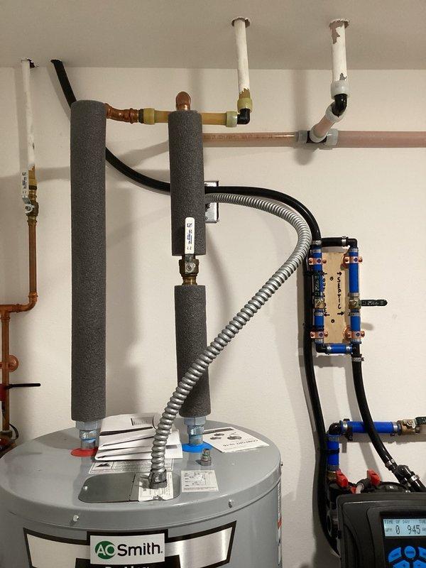 Responded to no hot water complaint on 4-year-old AO Smith electric water heater. Upon inspection, found ECO (energy cutoff) switch had tripped, cutting power to thermostats and heating elements. Reset ECO switch, restoring power to all components. Adjusted thermostat settings slightly lower to reduce likelihood of future trips. Customer reported this issue occurs approximately once per year, but root cause remains undetermined at this time. Recommend bringing multimeter on next service call if problem recurs to perform comprehensive electrical diagnostics.