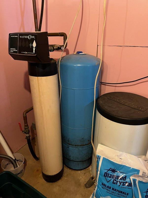 Responded to low water pressure complaint with fluctuating pressure readings between 8-12 PSI. Diagnosed 30-year-old pressure tank as waterlogged, causing inadequate pressure maintenance and constant fluctuation in the water system. Provided estimate for pressure tank replacement and coordinated scheduling for installation of new pressure tank, water softener, and filtration system to resolve the issue and improve overall water quality.