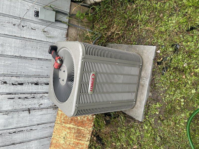 Completed comprehensive cooling system maintenance on Lennox air conditioning unit. Performed operational testing of AC system, inspected and serviced furnace components, cleared condensate drain line, and installed new air filter. Exterior service included component inspection and condenser coil cleaning. Identified capacitor reading below factory specifications and loose wiring connections at contactor, which were tightened to proper torque. Discovered moisture intrusion from intake line dripping into furnace due to high humidity conditions. Replaced deficient capacitor to restore proper system performance and presented options for inline drain kit installation to address condensation issue and prevent future moisture problems.