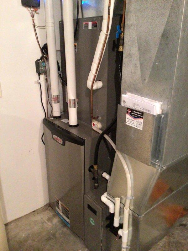 Completed comprehensive tune-up on 5-year-old AC and furnace systems, verifying proper operation of both units. Identified and corrected improper PVC condensate drain slope that was causing water to roll back onto the pipe; cut and reinstalled piping with proper pitch toward drain to ensure effective drainage. Discovered water in furnace room originating from water softener and coordinated plumbing contractor for same-day service to address the issue.