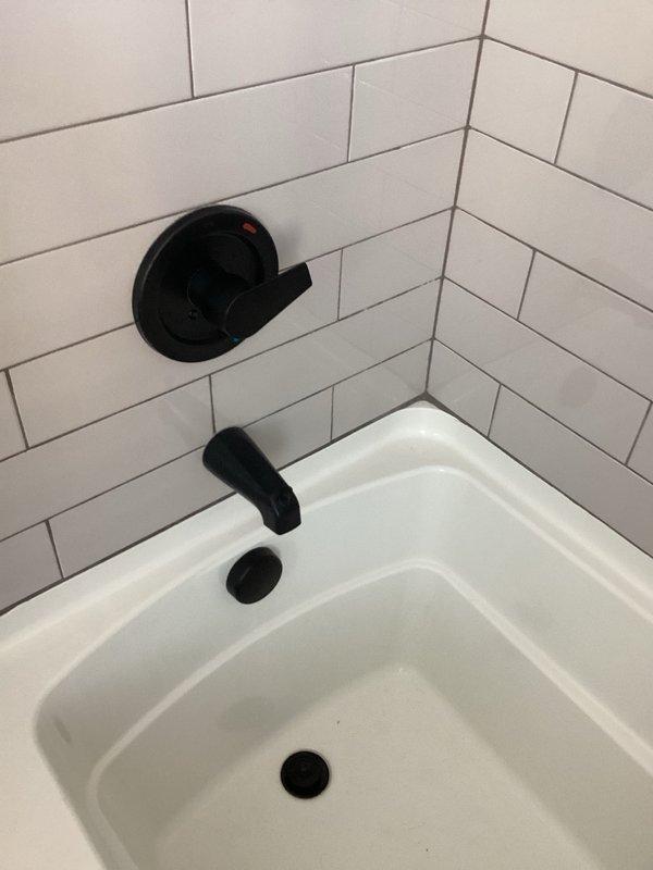 Responded to a leaking tub valve with exposed wall access. Removed the failed valve assembly and installed a new shower valve with the trim provided by the customer. Verified proper operation and confirmed no leaks upon completion.