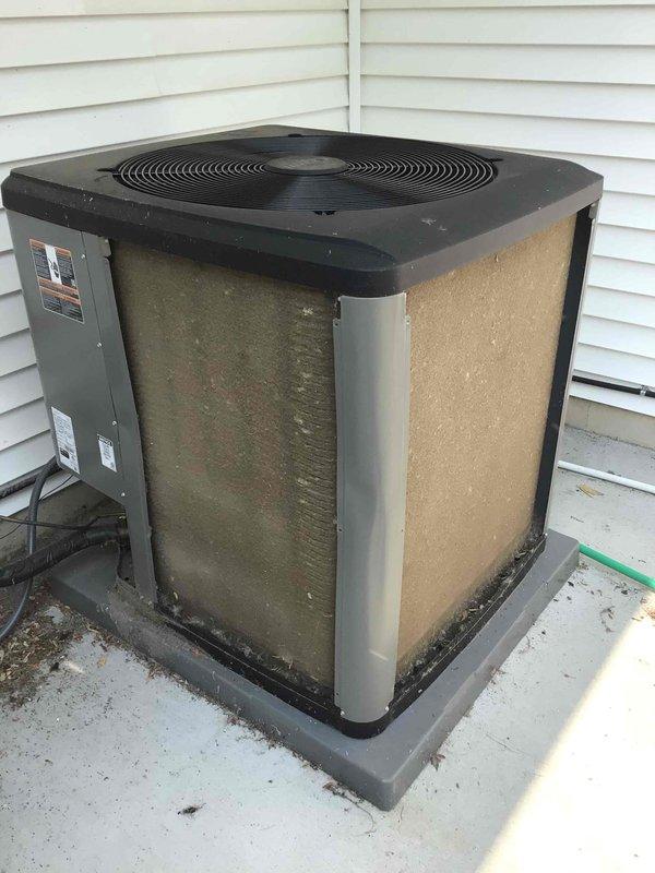 Completed comprehensive AC tune-up on outdoor condensing unit. Thoroughly washed exterior coils to remove heavy accumulation of dirt, debris, and biological growth that had built up on condenser fins and cabinet panels. Performed complete electrical inspection and verified all connections secure and within specifications. Unit operating properly with normal cooling performance; customer had recently replaced air filter prior to service visit.