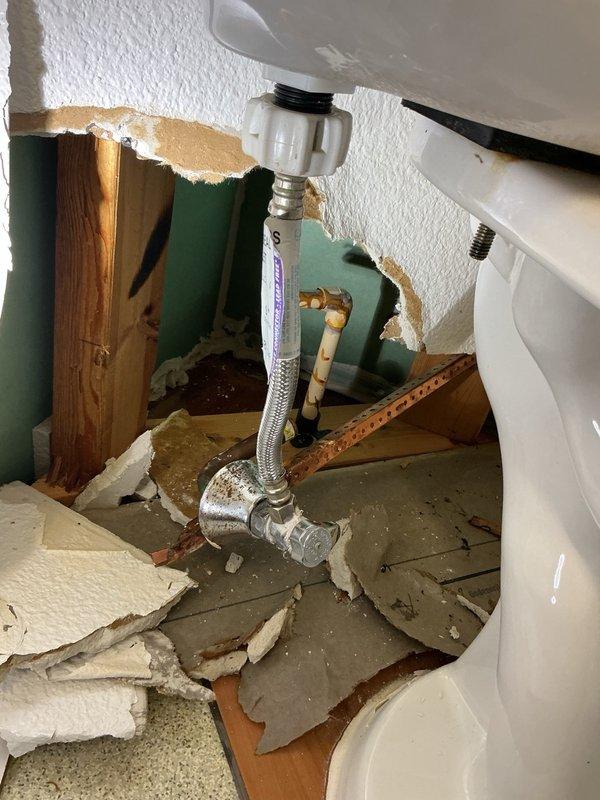 Responded to commercial water leak emergency at hotel guest room on third floor. Upon arrival, found CPVC waterline broken off behind toilet within wall cavity. Water supply had been shut off prior to arrival. Inspection revealed the CPVC line had fractured at mounting point, likely due to excessive force during toilet removal combined with material brittleness from age.

Removed damaged section of CPVC waterline and made clean cut to establish solid connection point. Installed PEX adapter fitting to transition from existing CPVC to new PEX piping. Stubbed out new waterline to proper location and installed new shut-off valve. Restored water supply to fixture and conducted 10-minute pressure test to verify system integrity and confirm no active leaks at repair points or connections.