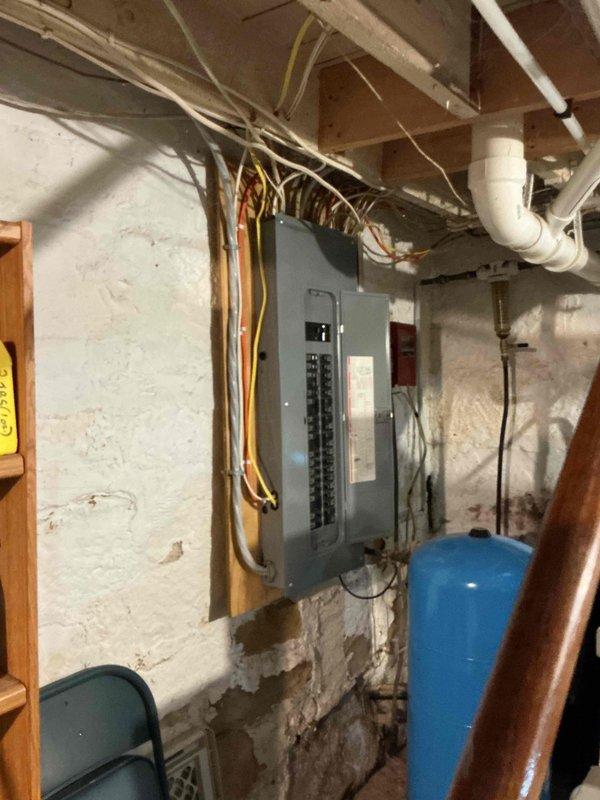 Responded to standing water issue around furnace base in basement. Upon inspection, discovered condensate pump running continuously but failing to discharge water due to clogged backflow preventer blocking water flow. Disassembled condensate pump assembly, thoroughly cleaned all components including backflow preventer, and reassembled system. Tested operation by adding water to condensate pump reservoir and verified proper pumping function and drainage to discharge point. System now operating correctly with no water accumulation.