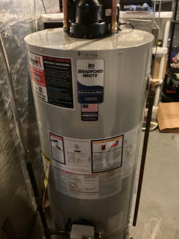 Responded to service call for 50-gallon natural gas water heater experiencing pilot light failure. Upon inspection, pilot light would ignite but would not remain lit, indicating likely thermocouple or gas control valve malfunction. Given the unit's age of 16 years, which exceeds the typical service life expectancy for residential water heaters, replacement was recommended rather than repair. Proceeded with complete water heater replacement, installing a new Bradford White 50-gallon natural gas water heater. Installation included proper venting connections, gas line hookup, cold water inlet and hot water outlet copper piping connections, temperature and pressure relief valve installation, and verification of all connections for proper operation and safety compliance.