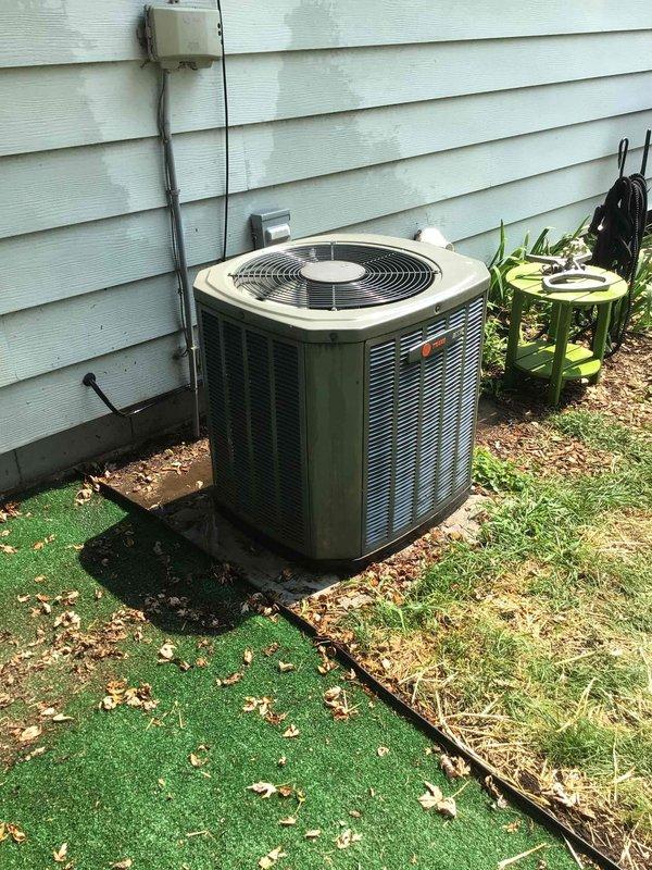 Performed comprehensive AC tune-up on 5-year-old Trane cooling system. Completed full maintenance protocol including washing outdoor condenser unit, testing all electrical components to verify proper specifications, replacing air filter, and measuring temperature differential across evaporator coil. All system parameters confirmed within manufacturer specifications and unit operating properly.