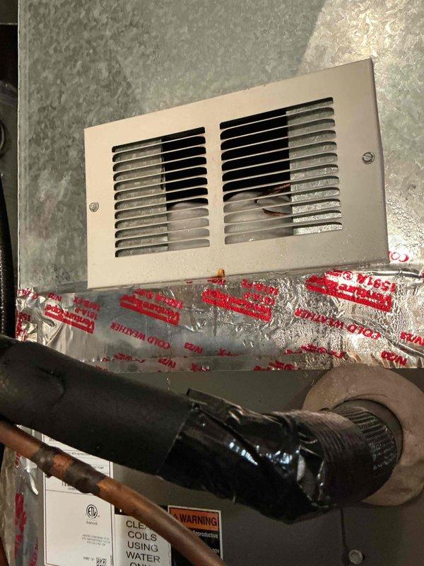 Responded to no cooling complaint on 2-year-old Lennox system and found complete freeze-up extending from evaporator coil to compressor. Upon inspection, discovered severely clogged air filter restricting airflow, which homeowner had recently replaced in attempt to resolve issue. Unable to complete full diagnostic testing due to ice buildup requiring thaw time, but restricted airflow from clogged filter identified as likely root cause of freeze condition requiring follow-up visit for verification once system defrosts.