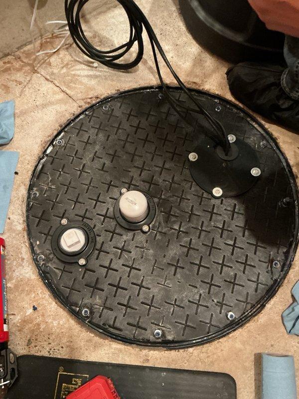 Responded to callback regarding sewer gas odor and drain fly issues in basement following previous sump pump installation. Upon inspection, discovered the sewer pit cover was not properly sealed, allowing gases to escape into the living space. Removed the existing cover, applied silicone sealant around the entire perimeter of the pit rim, reinstalled and secured the cover with screws, and cleaned excess sealant. Advised property owner to monitor the area for resolution of odor and pest concerns.