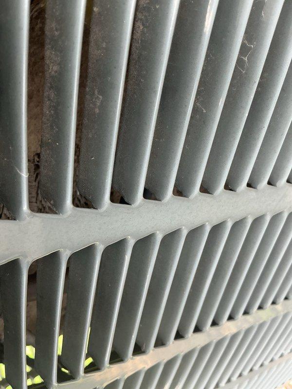 Responded to no cooling complaint on 25-year-old residential HVAC system. Upon inspection, discovered failed dual capacitor with severe corrosion, pitted contactor, condenser fan motor leaking oil, and cracked heat exchanger. Due to safety concerns with the compromised heat exchanger, tagged furnace as unsafe for operation. Replaced dual capacitor, contactor, and condenser fan motor to restore cooling functionality. Heat exchanger replacement required for safe heating operation.