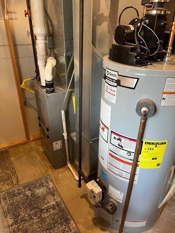 Responded to no cooling complaint with reported hissing noise from basement area. Upon inspection, found condenser fan motor seized, dual run capacitor testing out of specification on hermetic terminal, and contactor showing significant pitting. System pressure testing revealed critically low R22 refrigerant charge, indicating active leak in refrigerant circuit. Explained findings to homeowner including multiple component failures and refrigerant leak requiring repair. Recommended obtaining leak repair estimate and scheduling consultation to review repair options versus system replacement given age of equipment and R22 phase-out considerations.