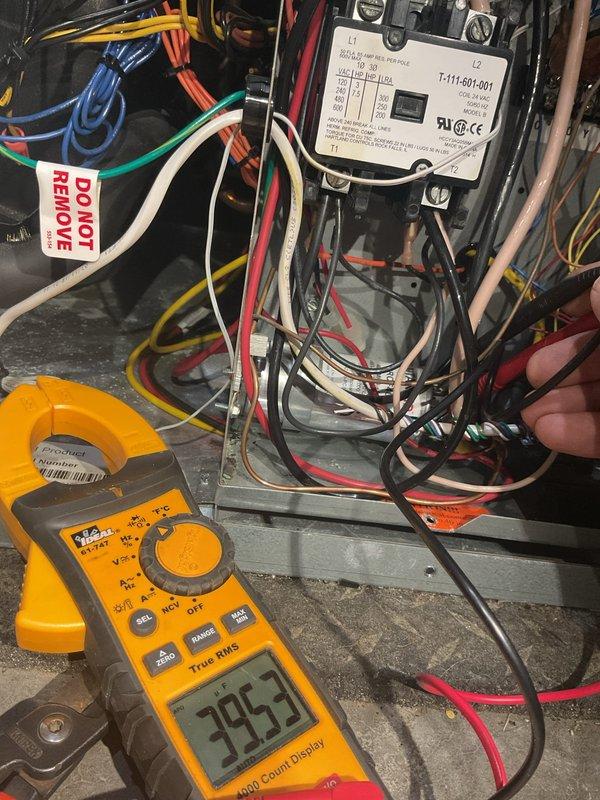 Performed comprehensive maintenance on 11-year-old geothermal heating and cooling system. Verified all pressures and temperatures were within manufacturer specifications, inspected capacitor and contactor for proper operation, and tested electrical components with multimeter showing no voltage drop despite minor pitting observed on contactor contacts. Cleaned condensate drain line, evaluated overall cooling operation, and confirmed system is functioning properly with an estimate provided for future contactor replacement as preventive maintenance.