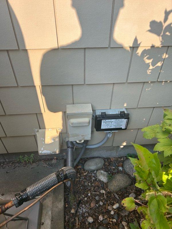 Completed warranty return visit to address thermostat and humidifier wiring integration. Rewired S40 thermostat to Aprilaire humidifier control board, removing the existing humidistat control, and verified proper operation of the system. Additionally, secured and locked the electrical disconnect cap that had been identified as unsecured during city inspection, ensuring code compliance and safety standards were met.
