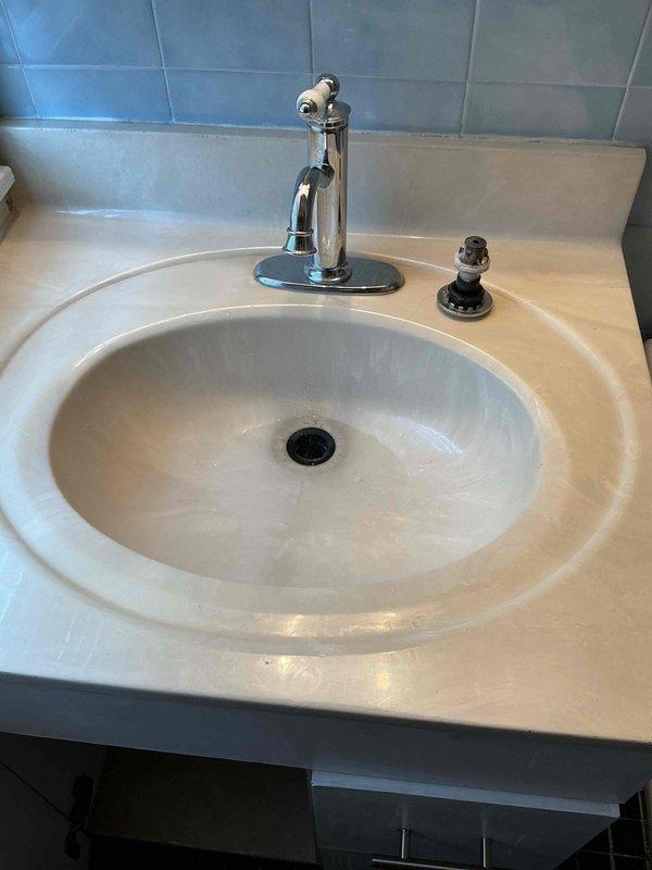 Responded to a service call for a bathroom sink backing up in the upstairs bathroom. Upon diagnostic testing, the drain backed up after running water for a few seconds, indicating a blockage in the line caused by hair accumulation. Cabled the bathroom sink drain to approximately 20 feet and successfully removed hair buildup from the line. Tested the drain by running water while cleaning up the work area and verified proper drainage with no leaks or backup issues. All fixtures returned to normal operation.