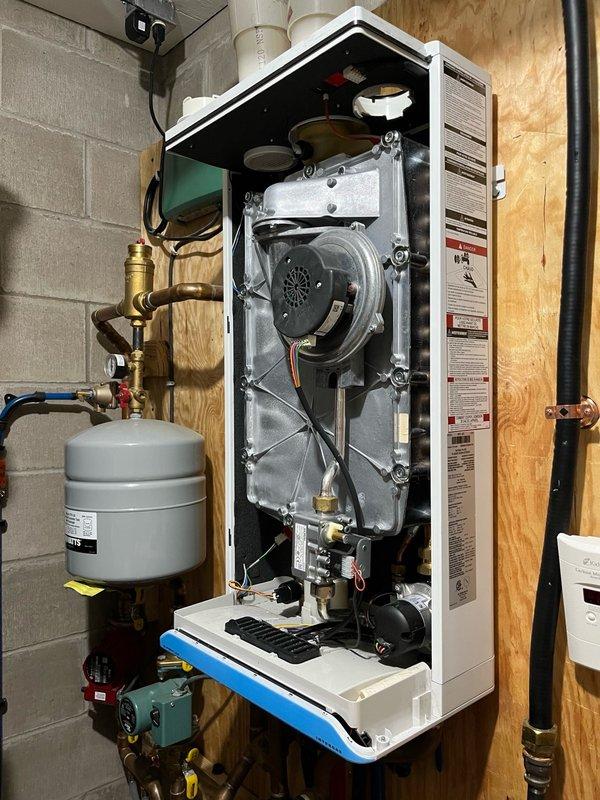 Completed comprehensive maintenance agreement service on Daikin mini-split air conditioning system and boiler. Performed AC tune-up including cleaning and inspection of electrical components on outdoor condenser unit, removed and verified clean filters from indoor head unit, and confirmed proper drainage operation. Conducted boiler inspection of routine components, removed and cleaned trap and igniter assembly with all measurements found within manufacturer specifications. System testing included running mini-split for 15 minutes with temperature split measuring 18-20 degrees, verified proper operation of in-floor heating and domestic hot water functions. All equipment operating as designed with no deficiencies noted.