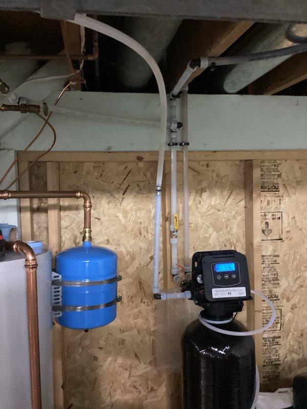 Responded to water leak investigation in basement utility area near previous installation. Upon inspection, located cracked and torn drain line causing intermittent pooling. Removed damaged section of drain line, installed PEX adapter, and coupled connection back to existing drain line to restore proper drainage and eliminate leak.