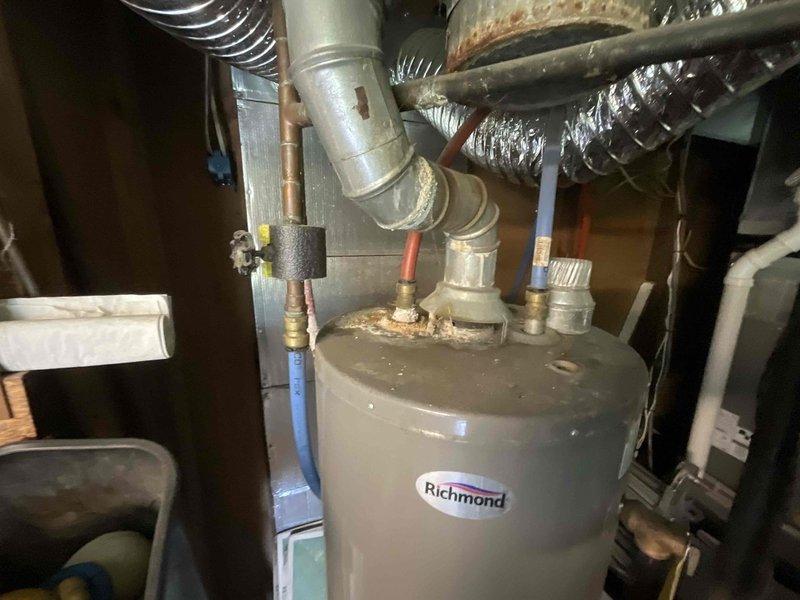 Completed routine plumbing inspection of residential property, examining water heater, supply lines, and drainage systems. Documented significant corrosion and rust accumulation on water heater pipe fittings and connections, noting oxidation on metal surfaces and joints that may require future attention. Inspected basement utility area plumbing infrastructure, including copper piping, PVC connections, and fixture installations, with photographic documentation provided for maintenance records.