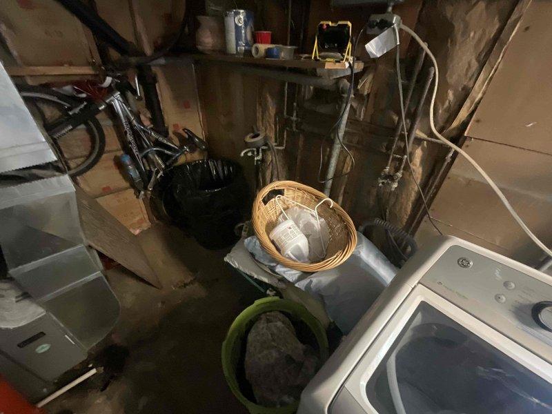 Completed routine plumbing inspection of residential property, examining water heater, supply lines, and drainage systems. Documented significant corrosion and rust accumulation on water heater pipe fittings and connections, noting oxidation on metal surfaces and joints that may require future attention. Inspected basement utility area plumbing infrastructure, including copper piping, PVC connections, and fixture installations, with photographic documentation provided for maintenance records.