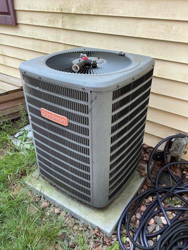 Completed annual cooling system maintenance on Goodman air conditioning unit as part of preventative maintenance agreement. Replaced heavily soiled air filter, verified evaporator drain line was flowing properly, and inspected all electrical components which tested within specifications. Cleaned condenser coil, started system, and verified proper operation with 18-degree temperature split across evaporator coil, confirming refrigerant charge is correct. System operating efficiently with no issues found.