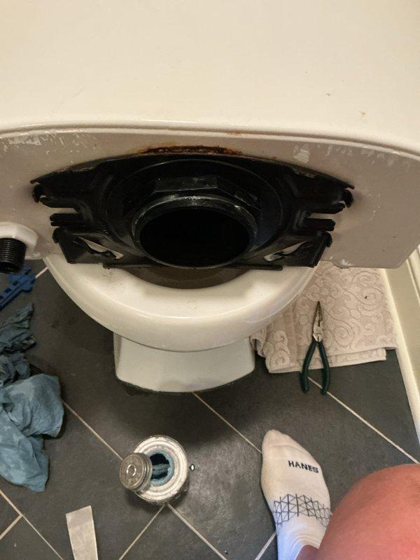 Responded to service call for toilet leaking from right side requiring bucket drainage every three hours. Diagnosed and repaired tank-to-bowl leak by removing toilet tank, cleaning deteriorated tank gaskets, and reinstalling with new seals to restore proper watertight connection and eliminate continuous water seepage.