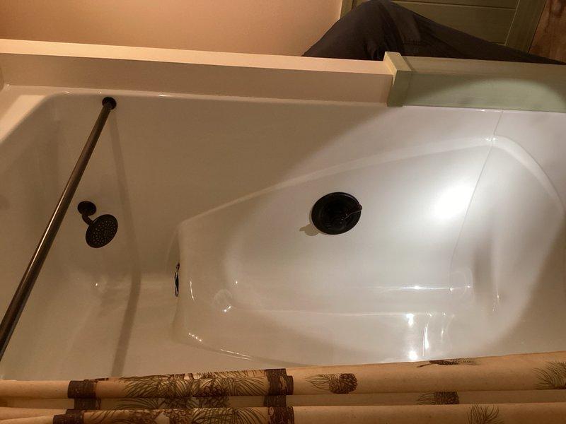 Completed comprehensive plumbing inspection of residential bathroom fixtures including shower basin and bathtub assembly. All fixtures, drains, and plumbing components were examined and found to be in proper working condition with no leaks or deficiencies noted.