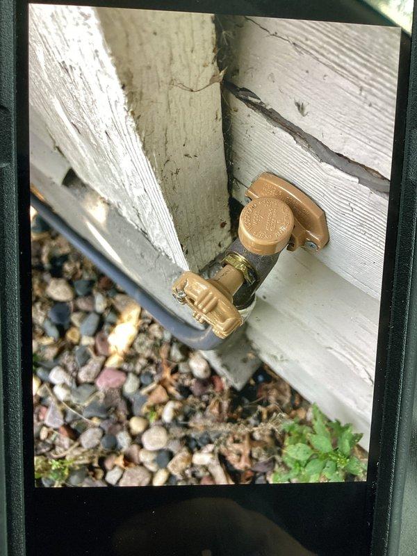 Responded to a water leak at an exterior hose bib that had been previously repaired. Upon inspection, identified that the packing nut had loosened, causing the leak at the valve stem. Tightened the packing nut to proper torque specifications, which resolved the leak and restored full functionality to the outdoor spigot.