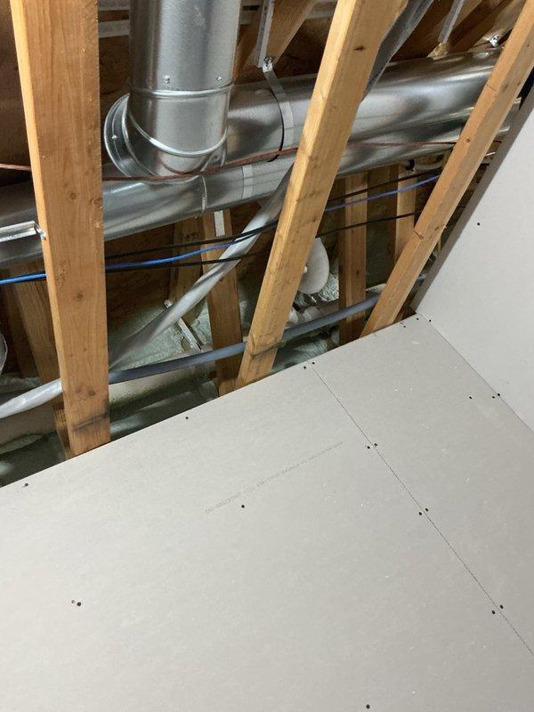Responded to call for condensation and dripping issues on water heater and associated piping. Upon inspection, found excessive condensation on waterlines due to elevated indoor temperature and active irrigation system causing temperature differential on cold water lines. Water heater temperature was set at approximately 140°F, and the temperature and pressure relief valve exhibited a slow leak. Replaced the defective relief valve with new unit and adjusted water heater thermostat to 125°F to prevent future relief valve issues and reduce energy consumption. Submitted parts order request for pipe insulation materials to address ongoing condensation concerns on affected waterlines. System tested and confirmed operational with no active leaks upon completion.