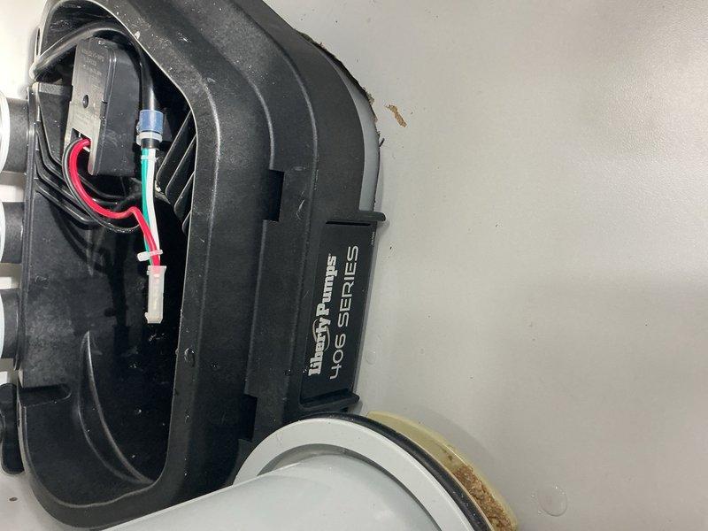 Responded to warranty callback for Liberty Pumps 40S series gravity pump system that had previously backed up. Upon inspection, diagnosed failed float switch preventing pump activation. Documented existing pump assembly and malfunctioning float mechanism. Provided estimate for float switch replacement to restore proper operation.